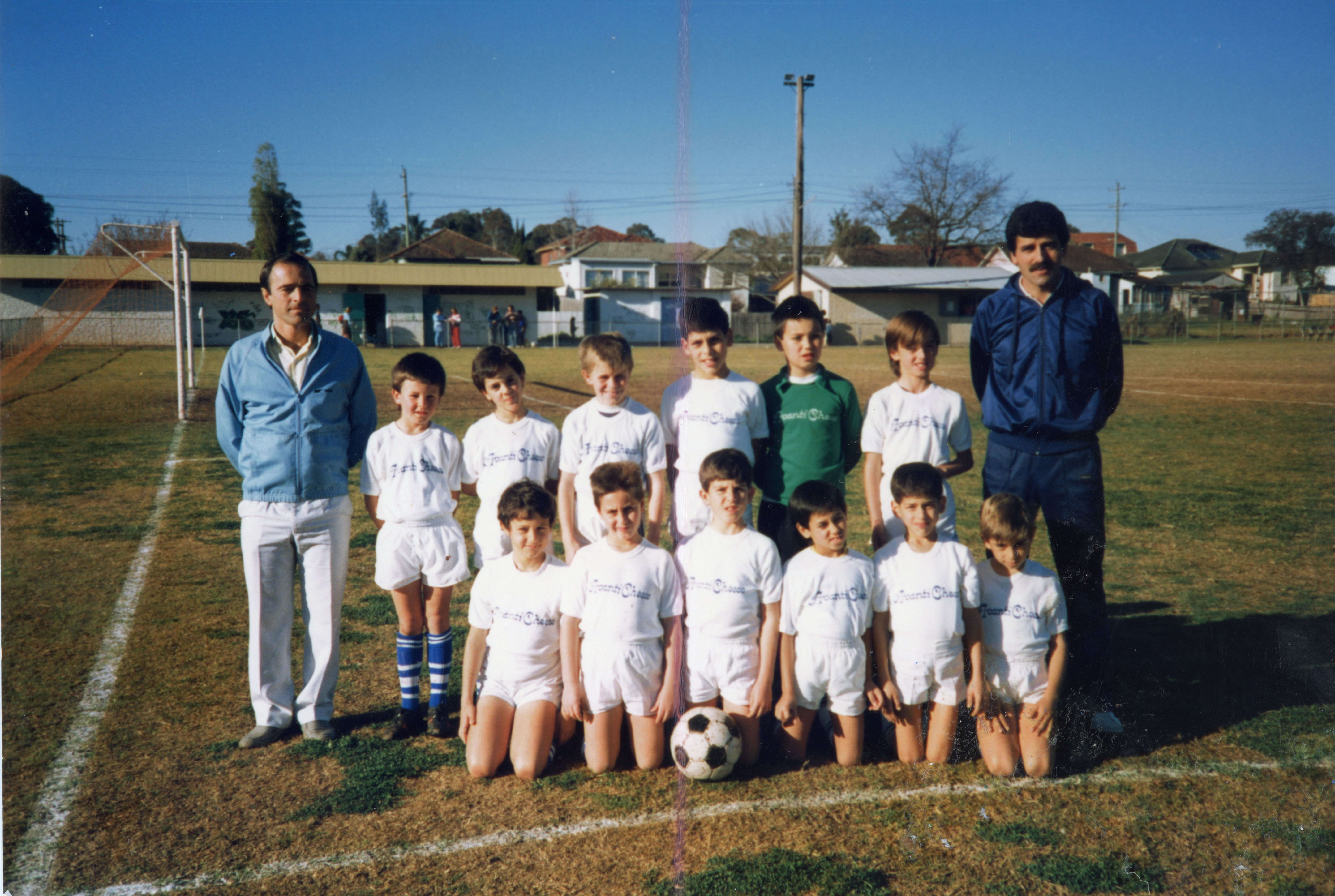 Group portrait of the under-sevens soccer team at Phillips Park, Lurnea, 1988.